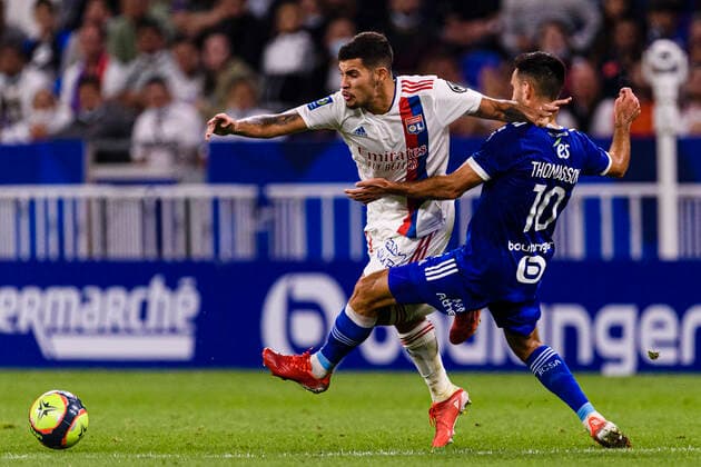 LYON, FRANCE SEPTEMBER 12 Bruno Guimaraes of Olympique Lyon L fights for the ball with Adrien Thomasson of Racing Strasbourg R during the warming up ahead of Ligue 1 Uber Eats match between Lyon and Strasbourg at Groupama Stadium on September 12, 2021 in Lyon, France Lyon France  Copyright: xJustPictures.ch MarcioxMachadox