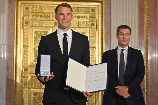 Manuel NEUER Goalkeeper Bayern Muenchen receives the Bavarian Order of Merit from Markus SOEDER Prime Minister of Bavaria and CSU Chairman and the award certificate Bavarian Order of Merit in the Prinz Carl Palais in Munich on 22 09 2021