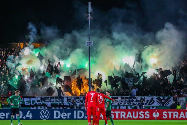 Football DFB Cup SC Preußen Münster Hertha BSC Berlin on 26 08 2021 at the Preußenstadion in Münster The Preußen Münster fans ignite pyrotechnics in their block