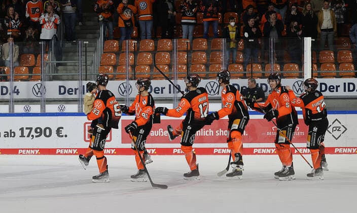 Spencer Machacek Grizzlys Wolfsburg with offspring on his arm , Jan Nijenhuis Grizzlys Wolfsburg , Jan Nijenhuis Grizzlys Wolfsburg , Armin Wurm Grizzlys Wolfsburg , Thomas Reichel Grizzlys Wolfsburg , Bjoern Krupp Grizzlys Wolfsburg , Sebastian Furchner Grizzlys Wolfsburg