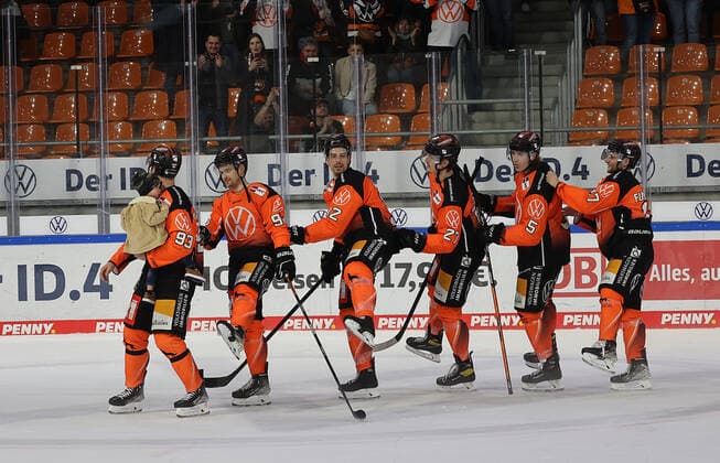 Spencer Machacek Grizzlys Wolfsburg with offspring on his arm , Jan Nijenhuis Grizzlys Wolfsburg , Jan Nijenhuis Grizzlys Wolfsburg , Armin Wurm Grizzlys Wolfsburg , Thomas Reichel Grizzlys Wolfsburg , Bjoern Krupp Grizzlys Wolfsburg , Sebastian Furchner Grizzlys Wolfsburg