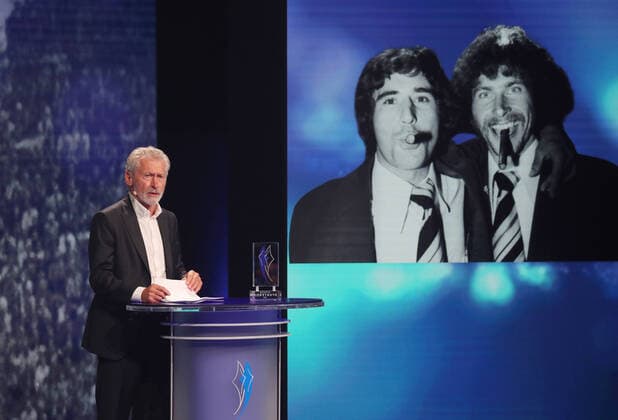 Paul Breitner commemorates the football legend Gerd Müller with his speech Paul Breitner holds the commemorative speech to the recently deceased Gerd Müller, here a picture in the background on which both are smoking cigars Munich Bayern Germany BMW World
