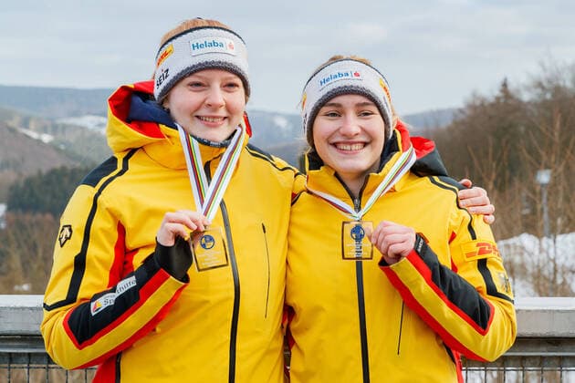 Luisa Romanenko with Pauline Patz GER, Germany winner, first place, gold medal, gold medal jubilation, celebration, 1 28 2022, Winterberg Germany , FIL Junior World Championships 2022 Winterberg xprx