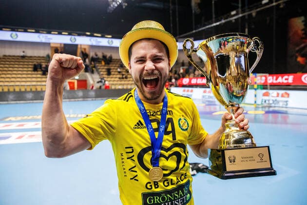 220205 Sävehofs Sebastian Karlsson cheers with the trophy after final 2 in the Swedish Cup between Sävehof and Lugi on 5 February 2022 in Partille,  Copyright: MICHAELxERICHSEN BB220205MI035