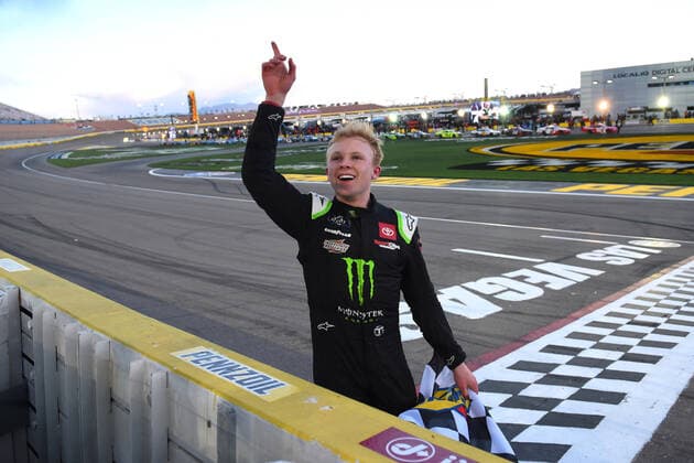 LAS VEGAS, NV - MARCH 05: Ty Gibbs ( 54 Joe Gibbs Racing Monster Energy Toyota) receives the Sunoco checkered flag as he celebrates winning the race during the NASCAR, Motorsport, USA Xfinity Series Alsco Uniforms 300 on March 05, 2022, at Las Vegas Motor Speedway in Las Vegas, NV. (Photo by Chris Williams Icon Sportswire) AUTO: MAR 05 NASCAR Xfinity Series - Alsco Uniforms 300 Icon0072203051199