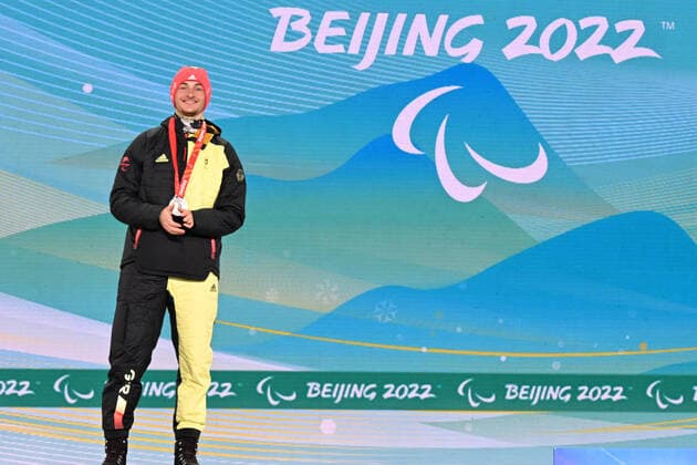 Paralympics Beijing 2022 Super G Beijing CHINA 06 03 22 Competition Day 2 Zhangjiakou Medal Plaza Award Ceremony Para Biathlon Sprint MAIER, Marco GER from SV Kirchzarten BAD , born 20 12 1999 in Oberstdorf, Paralympic classification LW8 standing wins silver Credit Ralf Kuckuck, DBS Yanging National Alpine Ski Center China