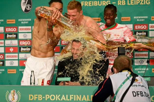 Beer shower for coach coach Domenico Tedesco RasenBallsport Leipzig RBL during the press conference PK led by Yussuf Poulsen 09 RasenBallsport Leipzig RBL 79 DFB Cup Final SC Freiburg SCF vs RB Leipzig RBL Olympiastadion Berlin 21 05 2022 DFL REGULATIONS PROHIBIT ANY USE OF PHOTOGRAPHS AS IMAGE SEQUENCES AND OR QUASI VIDEO 79 DFB Cup Final SC Freiburg SCF vs RB Leipzig RBL