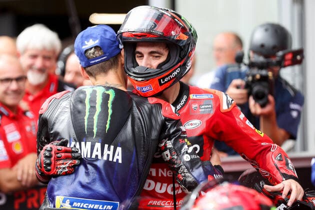 MOTORSPORTS - MotoGP, GP of Austria 2022 SPIELBERG,AUSTRIA,21.AUG.22 - MOTORSPORTS - MotoGP, Grand Prix of Austria, Red Bull Ring. Image shows the rejoicing of Fabio Quartararo (FRA Monster Energy Yamaha MotoGP) and Francesco Bagnaia (ITA Ducati Team).  GEPAxpictures xChristianxWalgram