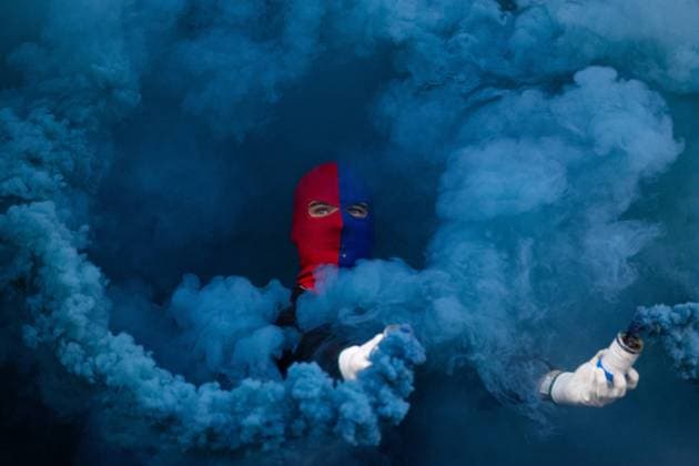 221113 An Örgryte supporter with pyrotechnics before the decisive football match in the qualifier for the Superettan between Örgryte and Sandvikens IF on November 13, 2022 in Gothenburg,  Copyright: MICHAELxERICHSEN BB221113MI059