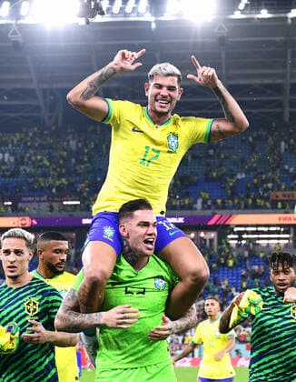 Football, World Cup, 2022, Men, Qatar, 6 Round of 16, Stadium 974t Stadium Brazil South Korea 4 1 final cheer Brazil, Ederson BRA , Bruno Guimaraes BRA cheer, joy, action FIFA REGULATES PROHIBIT ANY USE OF PHOTOGRAPHS AS IMAGE SEQUENCES AND OR QUASI VIDEO