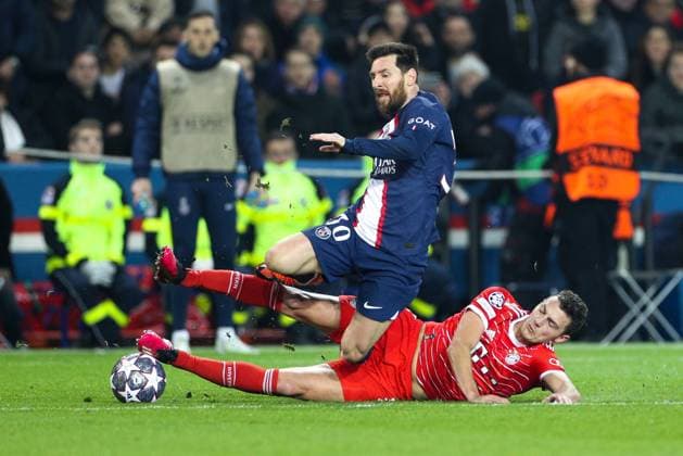 in duel, action, with Lionel Messi 30 Paris Saint Germain and Benjamin Pavard 5 FC Bayern Muenchen , Paris Saint Germain vs FC Bayern Muenchen, Champions League, Football, Round of 16, 14 02 2023 Paris Paris France Copyright: xkolbert-press ChristianxKolbertx