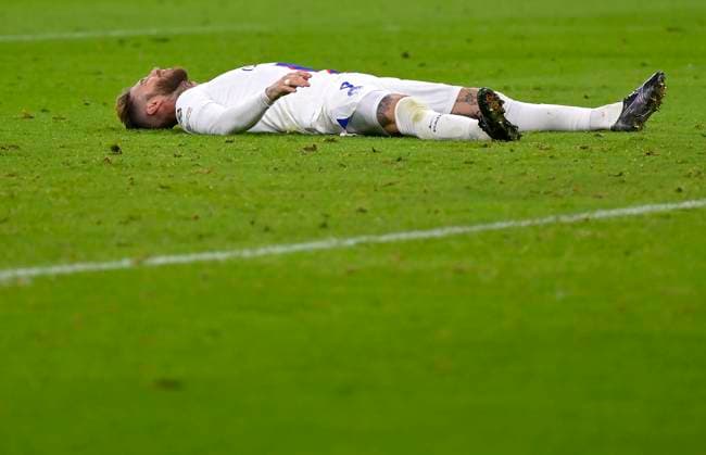 08 03 2023, Football UEFA Champions League 2022 2023 Round of 16 second leg, FC Bayern Munich Paris St Germain, at Allianz Arena Munich Sergio Ramos Paris Saint Germain lies disappointed on the ground