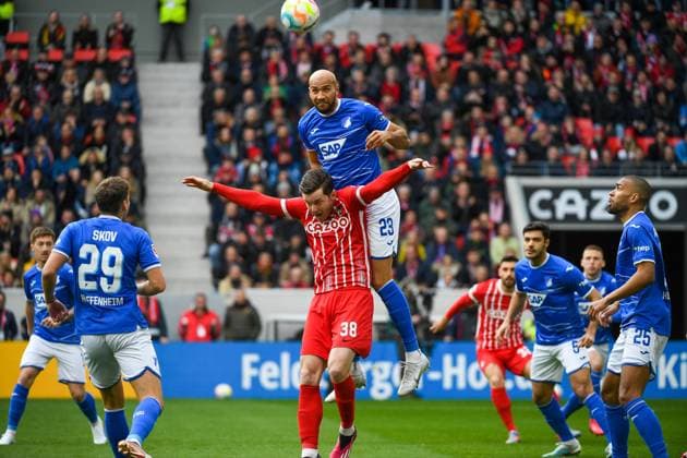 Football 1 Bundesliga 24 Matchday 22 23 SC Freiburg vs TSG 1899 Hoffenheim 12 03 2023 John Anthony Brooks TSG 1899 Hoffenheim 23 in a header duel with Michael Gregoritsch SC Freiburg 38 Football 1 Bundesliga SC Freiburg vs TSG 1899 Hoffenheim on Sunday, 12 March 2023 at Europa Park Stadium in Freiburg im Breisgau DFL REGULATIONS PROHIBIT ANY USE OF PHOTOGRAPHS AS IMAGE SEQUENCES AND OR QUASI VIDEO Copyright: xBEAUTIFULxSPORTS GerdxGruendlx