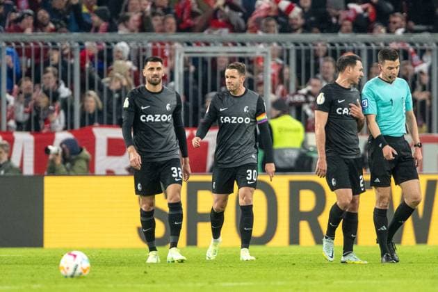 Vincenzo Grifo SC Freiburg, 32 and Christian Guenter SC Freiburg 30 is disappointed disappointed, dissatisfied after goal to 1 0 by Dayot Upamecano FC Bayern Muenchen, 02 , GER, FC Bayern Muenchen FCB vs SC Freiburg SCF , Football, DFB Pokal, Quarterfinal, Spielzeit 2022 2023, 04 04 2023, DFB DFL regulations prohibit any use of photographs as image sequences and or quasi video , GER, FC Bayern Muenchen FCB vs SC Freiburg SCF , Fussball, DFB Pokal, Viertelfinale, Spielzeit 2022 2023, 04 04 2023 Muenchen Copyright: xEibner-Pressefoto SaschaxWaltherx EP_EER