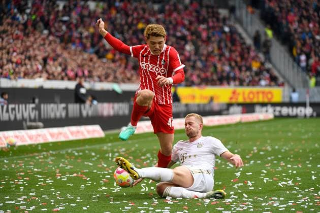Football 1 Bundesliga 27 Matchday 22 23 SC Freiburg vs FC Bayern Muenchen 08 04 2023 Matthijs de Ligt FC Bayern Muenchen 4 in duel with Ritsu Doan SC Freiburg 42 Football 1 Bundesliga SC Freiburg vs FC Bayern Muenchen on Saturday, 08 April 2023 at Europa Park Stadium in Freiburg im Breisgau DFL REGULATIONS PROHIBIT ANY USE OF PHOTOGRAPHS AS IMAGE SEQUENCES AND OR QUASI VIDEO Copyright: xBEAUTIFULxSPORTS GerdxGruendlx