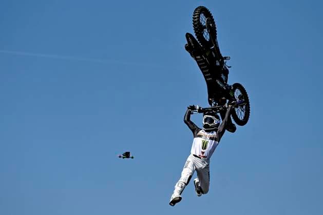 FMX freestyler in action followed by drone, Switzerland, 03 06 2023