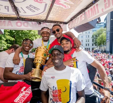 The team of RB Leipzig drives with a motorcade from the new city hall of the city to the festival meadow, here Amadou Haidara, Mohamed Simakan, Abdou Diallo, Christopher Nkunku and team manager Babacar N Diaye motorcade RB Leipzig after the DFB Cup Final 2023 against Eintracht Frankfurt 4 June 2023 Leipzig Saxony motorcade RB Leipzig Cup Final 2023