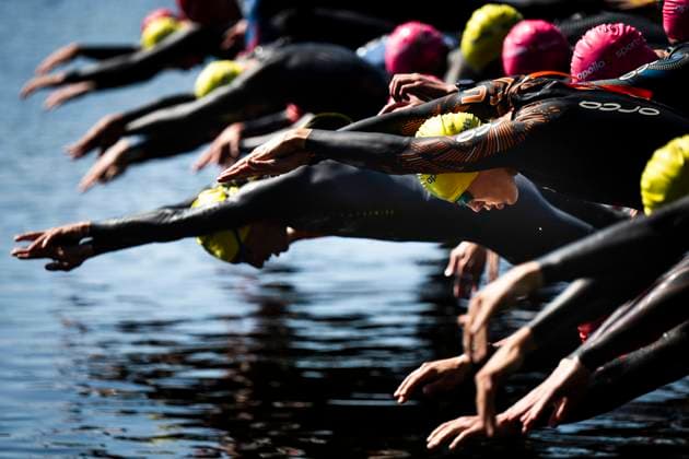 230629 Participants at the start of the swimming part of the triathlon during day 3 of the SM week on June 29, 2023 in Umea.  Copyright: SIMONxELIASSON BB230629SE020
