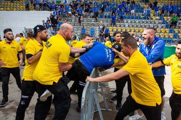 Jena , 120823, Football DFB Cup , FC Carl Zeiss Jena against Hertha BSC Berlin in the picture Heavy rioting between fans of Hertha BSC and Carl Zeiss Jena , injured stewards and fans Hertha fans push open a gate and storm the stadium