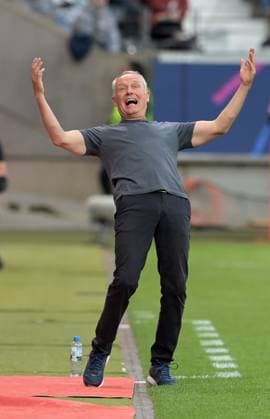 SC Freiburg coach Christian Streich takes photos during the Bundesliga soccer match Eintracht Frankfurt vs SC Freiburg on 24 9 2023 in Frankfurt DFL DFB REGULATIONS PROHIBIT ANY USE OF PHOTOGRAPHS as IMAGE SEQUENCES and or QUASI VIDEO