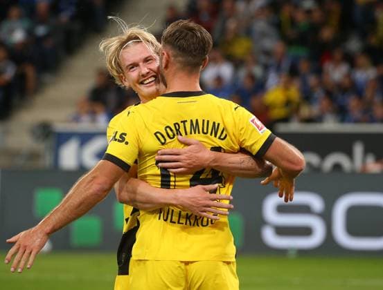 29 09 2023, Germany, Sinsheim, Fußball Bundesliga, Saison 2023 2024, TSG 1899 Hoffenheim vs Borussia Dortmund, v l Julian Brandt is happy with the goal scorer Niclas Füllkrug about the goal to 0 1 According to the regulations of the DFL Deutsche Fußball Liga it is prohibited to exploit or have exploited photographs taken in the stadium and or from the game in the form of sequence pictures and or video-like photo series