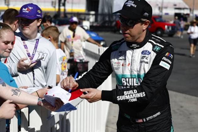 LAS VEGAS, NV - OCTOBER 14: Brad Keselowski ( 6 RFK Racing BuildSubmarines.com Ford) signs autographs during qualifying for the South Point 400 NASCAR, Motorsport, USA Cup Series Playoff race on October 14, 2023, at Las Vegas Motor Speedway in Las Vegas, NV. (Photo by Jeff Speer LVMS Icon Sportswire) AUTO: OCT 14 NASCAR Cup Series Playoff South Point 400 EDITORIAL USE ONLY Icon231014012