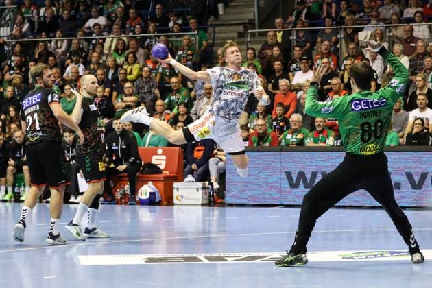 Jonathan Edvardsson TSV Hannover Burgdorf,26 against goalkeeper Nikola Portner SC Magdeburg,80 Handball Bundesliga Season 2023 2024 SC Magdeburg vs TSV Hannover Burgdorf at GETEC Arena in Magdeburg Action,Handball,Germany,15 10 2023