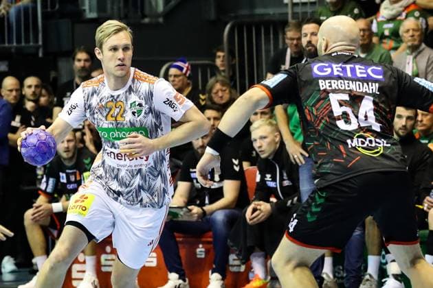 Marian Michalczik TSV Hannover Burgdorf,22 vs Oscar Bergendahl SC Magdeburg,54 Handball Bundesliga Season 2023 2024 SC Magdeburg vs TSV Hannover Burgdorf at GETEC Arena in Magdeburg Action,Handball,Germany,15 10 2023