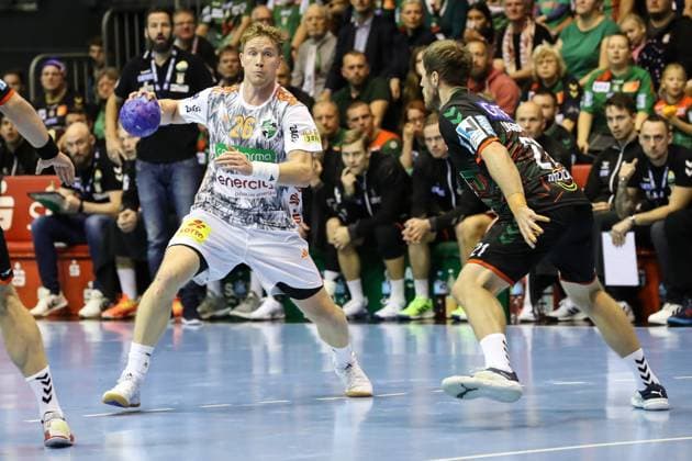 Jonathan Edvardsson TSV Hannover Burgdorf,26 vs Albin Lagergren SC Magdeburg,21 Handball Bundesliga Season 2023 2024 SC Magdeburg vs TSV Hannover Burgdorf at GETEC Arena in Magdeburg Action,Handball,Germany,15 10 2023
