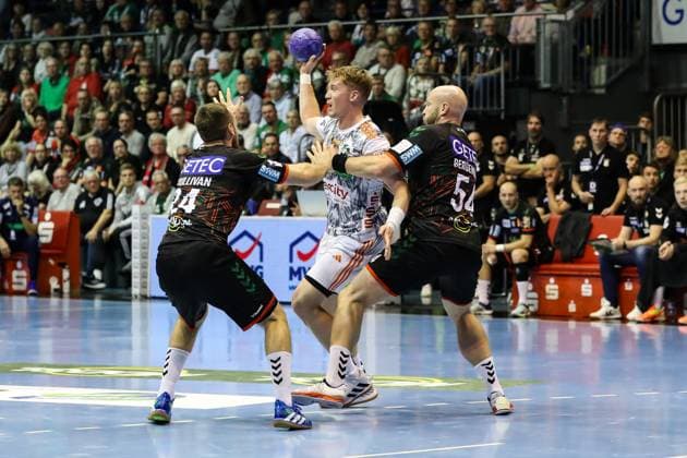 Jonathan Edvardsson TSV Hannover Burgdorf,26 vs Oscar Bergendahl SC Magdeburg,54 and Christian O Sullivan SC Magdeburg,24 Handball Bundesliga Season 2023 2024 SC Magdeburg vs TSV Hannover Burgdorf at GETEC Arena in Magdeburg Action,Handball,Germany,15 10 2023