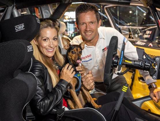 Moderator Andrea Kaiser with husband Sebastien Ogier eight-time rally world champion and driver Toyota Gazoo Racing World Rally Team and their dog ADAC Motorsport press conference PK to the Central European Rally FIA World Rally Championship at Motorworld in Munich Date 16 10 2023