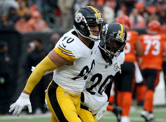 Pittsburgh Steelers T.J. Watt (90) celebrates with Patrick Peterson (20) afters sacking Cincinnati Bengals quarterback Jake Browing (6) during the first half of play at Paycor Stadium on Sunday, November 26, 2023 in Cincinnati. Ohio. KYP20231126006 JOHNxSOMMERSxII