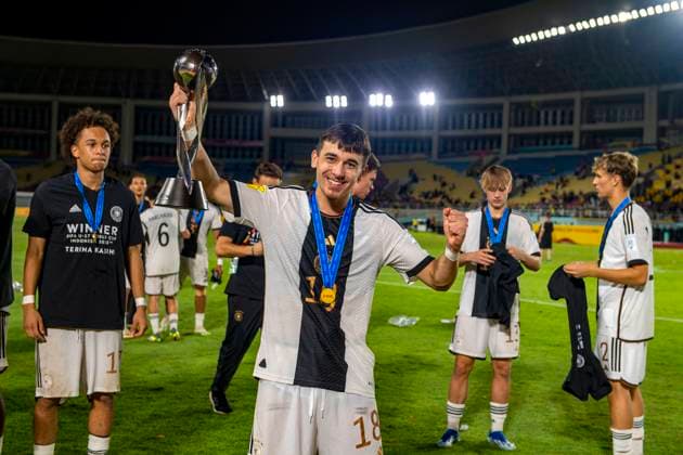 02 12 2023, Football U 17 World Cup 2023, Final Germany France, at Manahan Stadium Surakarta World Champion Germany celebrates the title after winning the penalty shootout Bilal Yalcinkaya Germany proudly with the World Champion Cup trophy