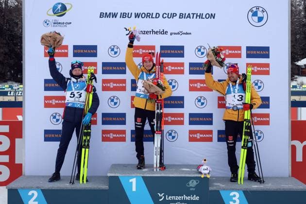 Lenzerheide, Switzerland 15 December 2023 IBU Biathlon World Cup Lenzerheide Sprint Men 2023 Pictured from left Johannes Thingnes Boe Norway in second place, winner Benedikt Doll SZ Breitnau GER and third-placed Philipp Nawrath SK Nesselwang GER Biathlon Arena Graubünden Copyright: xFotostandx xHettichx