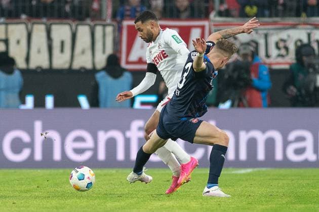 Match between Linton Maina 1 FC Koeln, 37 and Lennard Maloney FC Heidenheim, 33 Soccer 1 Bundesliga, Season 2023 2024, Matchday 17, 1 FC Koeln 1 FC Heidenheim 1846 on 13 01 2024 at the RheinEnergieStadion in Koeln Important notice According to the regulations of the DFL Deutsche Fussball Liga and the DFB Deutscher Fussball Bund it is prohibited, to utilize or have utilized photographs taken in the stadium and or of the match in the form of sequential images and or video-like photo series Foto Kirchner Media TH Copyright: xKirchner-Media THx