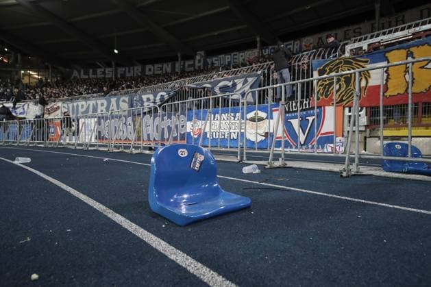 08 03 2024, xtgx, Soccer 2 Bundesliga, Eintracht Braunschweig Hansas Rostock emspor, v l The fans of Hansa Rostock riot, a chair seat was torn out of the guest block DFL DFB REGULATIONS PROHIBIT ANY USE OF PHOTOGRAPHS as IMAGE SEQUENCES and or QUASI VIDEO Braunschweig