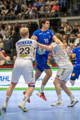 Magnus Saugstrup SC Magdeburg, 23 and Omar Ingi Magnusson SC Magdeburg, 14 in a duel against Mads Kjeldgaard Andersen Bergischer HC, 15 Handball LIQUI MOLY HBL, Season 2023 2024, Matchday 24, Bergischer HC SC Magdeburg on 24 03 2024 at Mitsubishi Electric Halle in Duesseldorf Photo Kirchner Media TH Copyright: xKirchner-Media THx