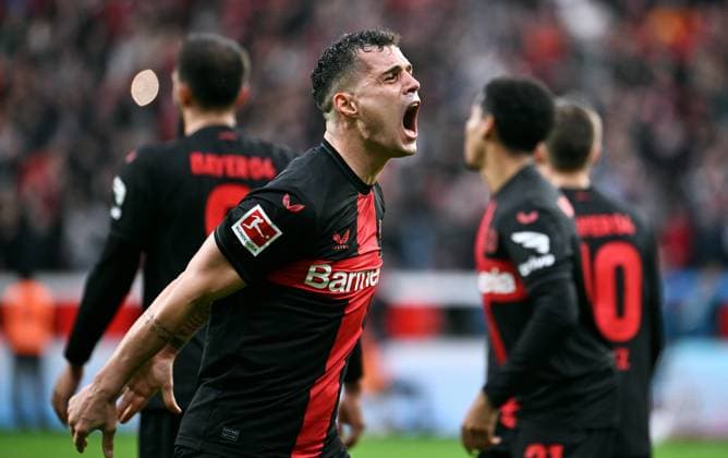Soccer, Bundesliga, Germany, Men, Season 2023 2024, Matchday 27, BayArena Leverkusen, Bayer Leverkusen TSG Hoffenheim 2 1 Cheers Granit Xhaka LEV after the goal to 2 1 by Patrik Schick LEV Cheers, joy, action DFB DFL REGULATIONS PROHIBIT ANY USE OF PHOTOGRAPHS AS IMAGE SEQUENCES AND OR QUASI VIDEO