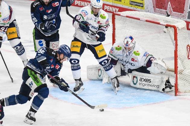 Straubing Tigers vs Grizzlys Wolfsburg, Ice Hockey, German Ice Hockey League, Penny DEL, Matchday 3 Playoffs Quarterfinals, Season 2022 2023, 19 03 2023 Marcel Brandt Straubing Tigers with the chance in front of Jake Hildebrand Eisbären Eisbaeren Berlin , Ice Hockey Men, German Ice Hockey League, Penny DEL, PlayOffs Semi-Final, Matchday 4, Season 2023 2024 on 07 04 2024 at the Eisstadion am Pulverturm, Straubing Tigers blue against Eisbären Eisbaeren Berlin white