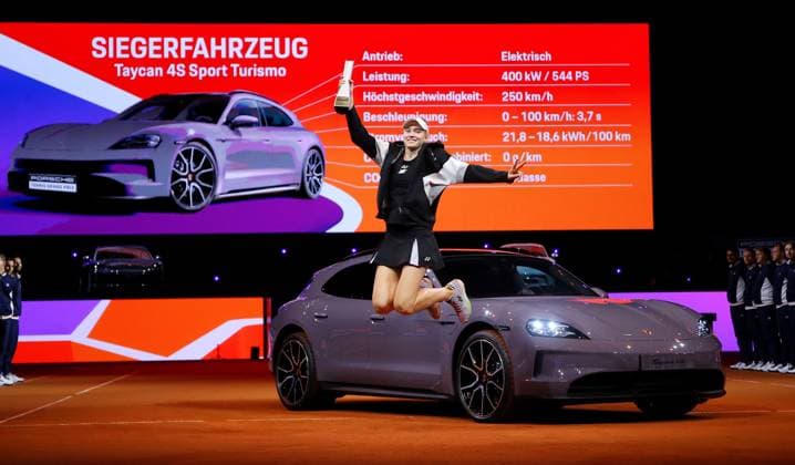 21 04 2024, Germany, Stuttgart, Porsche Tennis Grand Prix 2024, Final, Elena Rybakina KAZ jumps into the air with the trophy in front of her winning car Taycab 4S Sport Turismo
