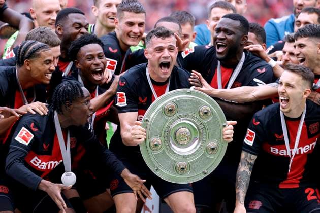 XHAKA Granit Team Bayer 04 Leverkusen at the award ceremony with the championship trophy DFL Bundesliga season 2023 2024 Championship celebration Bundesliga match Bayer 04 Leverkusen FC Augsburg on 18 05 2024 in Leverkusen DFL REGULATIONS PROHIBIT ANY USE OF PHOTOGRAPHS as IMAGE SEQUENCES and or QUASI VIDEO Copyright: xLacixPerenyix