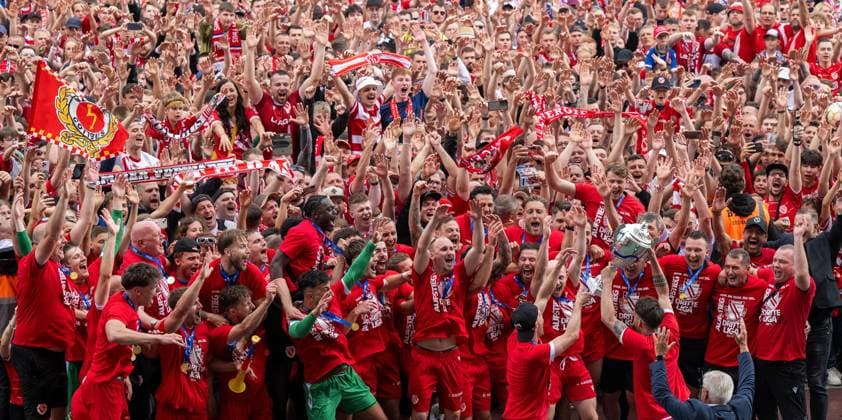 Soccer, Men, Season 2023 24, Regionalliga Nordost 34 Matchday , Hertha BSC II FC Energie Cottbus 0 2 , Fans and players of Energie celebrate the promotion, below Jonas Hildebrandt has Energie Cottbus the championship trophy, 19 05 2024, Copyright: xMatthiasxKochx
