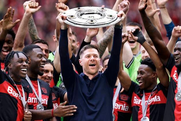 ALONSO Xabi Trainer Team Bayer 04 Leverkusen at the award ceremony with the championship trophy DFL Bundesliga season 2023 2024 Championship celebration Bundesliga match Bayer 04 Leverkusen FC Augsburg on 18 05 2024 in Leverkusen DFL REGULATIONS PROHIBIT ANY USE OF PHOTOGRAPHS as IMAGE SEQUENCES and or QUASI VIDEO Copyright: xLacixPerenyix