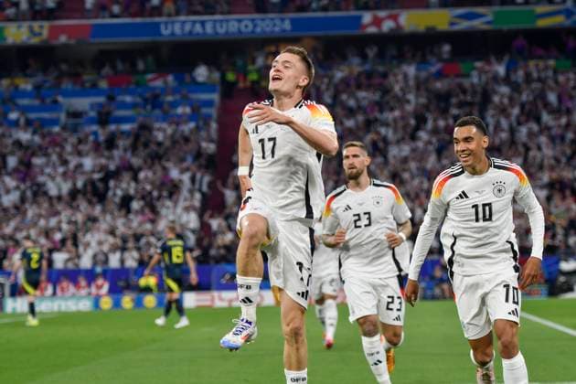 Florian Wirtz 17, Germany celebrates after scoring 1 0 with Jamal Musiala 10, Germany Robert Andrich 23, Germany 14 06 2024 European Football Championship in Germany Germany vs Scotland, Allianz Arena, Munich, Bayern Germany Copyright: xpepphotox xHorstxMauelshagenx pep00321, pep_20240614_hm