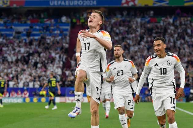Florian Wirtz 17, Germany celebrates after scoring 1 0 with Jamal Musiala 10, Germany Robert Andrich 23, Germany 14 06 2024 European Football Championship in Germany Germany vs Scotland, Allianz Arena, Munich, Bayern Germany Copyright: xpepphotox xHorstxMauelshagenx pep00321, pep_20240614_hm