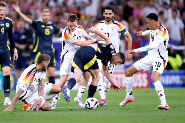 WIRTZ Florian Team Germany with MUSIALA Jamal and CHRISTIE Ryan UEFA Football EURO 2024 in Germany Opening match Germany Scotland on 14 06 2024in Munich DFL REGULATIONS PROHIBIT ANY USE OF PHOTOGRAPHS as IMAGE SEQUENCES and or QUASI VIDEO Copyright: xLacixPerenyix