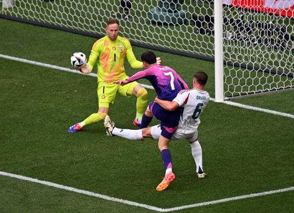 19 06 2024, xjhx, European Football Championship 2024, Germany Hungary emspor, v l Peter Gulacsi Hungary , Kai Havertz German National Football Team DFB , Willi Orban Hungary UEFA REGULATIONS PROHIBIT ANY USE OF PHOTOGRAPHS as IMAGE SEQUENCES and or QUASI VIDEO Stuttgart