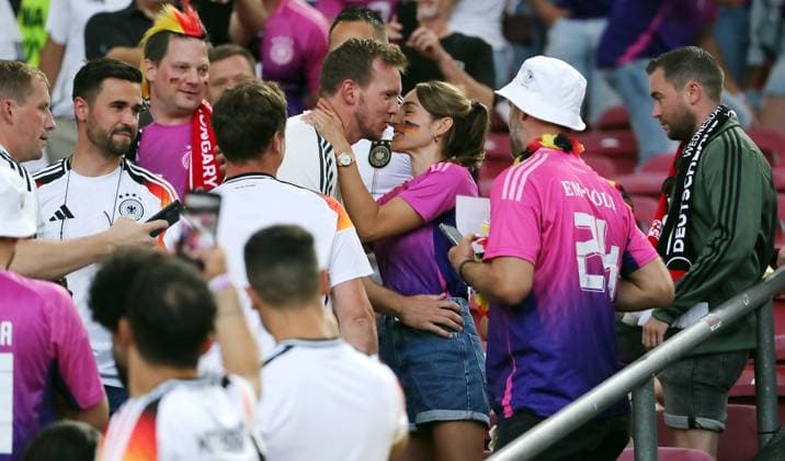 Coach Julian Nagelsmann climbs up to his girlfriend Lena Wurzenberger and gets a kiss Sports Football Soccer European Championship Euro 2024 European Championship Men Season 2023 2024 19 06 2024 Germany GER vs Hungary HUN in Stuttgart DFL regulations prohibit any use of photographs as image sequences and or quasi video