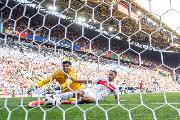 GER, Euro 2024, Group F, Turkey TUR vs Portugal PRT , 22 06 2024, BVB Stadion Dortmund Signal Iduna Park, Dortmund, GER, Euro 2024, Group F, Turkey TUR vs Portugal PRT , In the picture Goal for 2 0 own goal Bayindir Altay Turkey TUR Turkey TUR, 12 and Celik Mehmet Zeki Turkey TUR Turkey TUR, 2 try to save the ball, behind goal camera nordphotoxGmbHxx xChristianxSchulze nph000300