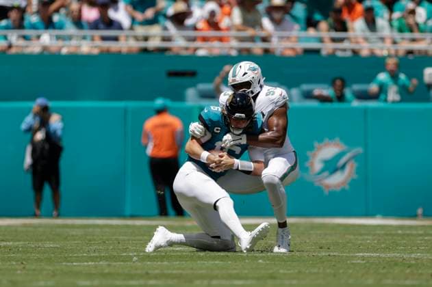 MIAMI GARDENS, FL - SEPTEMBER 08: Miami Dolphins defensive tackle Calais Campbell (93) sacks Jacksonville Jaguars quarterback Trevor Lawrence (16) during the game between the Jacksonville Jaguars and the Miami Dolphins on September 8, 2024 at Hard Rock Stadium in Maimi Gardens, Fl. (Photo by David Rosenblum Icon Sportswire) NFL, American Football Herren, USA SEP 08 Jaguars at Dolphins EDITORIAL USE ONLY Icon240908181316